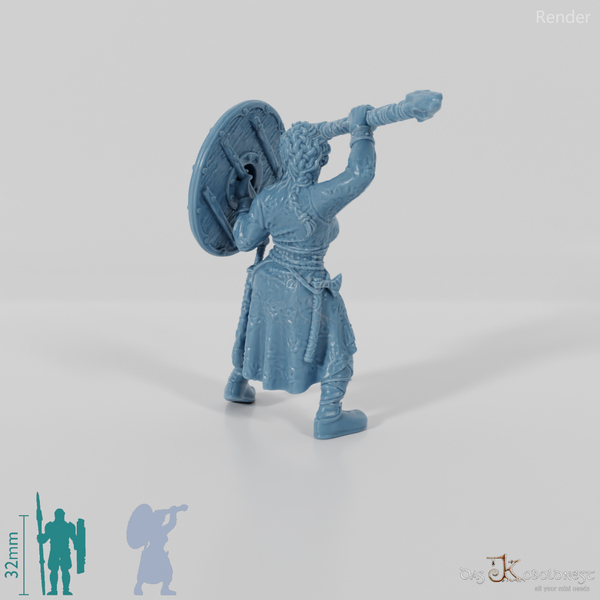 Nordic shieldmaiden with shield and raised spear